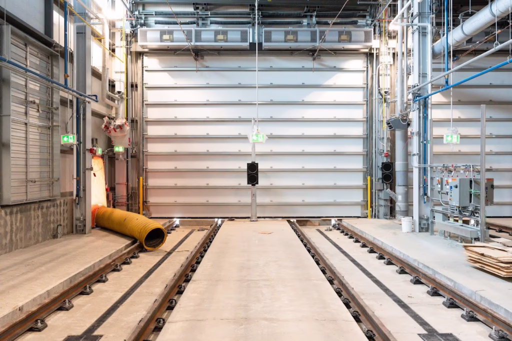 Large sectional door inside the Gerry Wright LRT Facility in Edmonton, supporting safe and efficient transit operations.